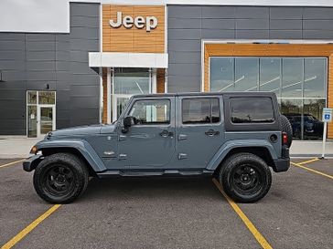 2015 Jeep Wrangler Unlimited Sahara in a Anvil Clear Coat exterior color and Blackinterior. Victor Chrysler Dodge Jeep Ram 585-236-4391 victorcdjr.com 