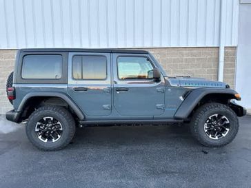 2024 Jeep Wrangler 4-door Rubicon 4xe in a Anvil Clear Coat exterior color and Blackinterior. Wilmington Auto Center Chrysler Dodge Jeep Ram (937) 556-6430 wilmingtonautocentercdjr.com 