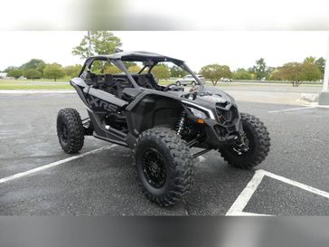 2025 CAN-AM MAVERICK X3 X RS TURBO RR WITH SMARTSHOX TRIPLE BLACK in a TRIPLE BLACK exterior color. Family PowerSports (877) 886-1997 familypowersports.com 