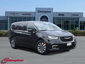 2023 Chrysler Pacifica Plug-in Hybrid Touring L in a Brilliant Black Crystal Pearl Coat exterior color and CAPRICE LEATHERinterior. Champion Chrysler Jeep Dodge Ram 800-549-1084 pixelmotiondemo.com 