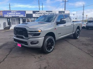 New 2026 RAM 2500 Laramie Crew Cab 4x4 6'4' Box in a Ceramic Gray Clear Coat exterior color. Kamaaina Motors 1-808-746-7956 kamaainamotors.com 