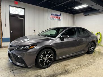 Used 2023 Toyota Camry SE Nightshade in a PREDAWN GRAY MICA exterior color and Blackinterior. Jensen Chrysler Dodge Jeep Ram 507-354-0542 jensenchryslerdodgejeepram.com 