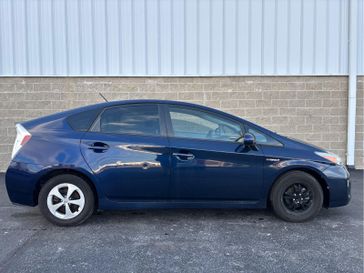 2014 Toyota Prius Three in a Nautical Blue Metallic exterior color and Misty Grayinterior. Wilmington Auto Center Chrysler Dodge Jeep Ram (937) 556-4751 wilmingtonautocentercdjr.com 