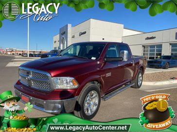 2017 RAM 1500 Laramie in a Delmonico Red Pearl Coat exterior color and Blackinterior. Legacy Auto Center 620-315-9264 legacyautocenter.net 