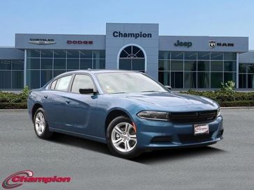 2023 Dodge Charger SXT Rwd in a Frostbite exterior color and HOUNDSTOOTHinterior. Champion Chrysler Jeep Dodge Ram 800-549-1084 pixelmotiondemo.com 