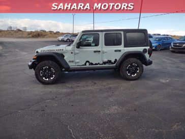 2024 Jeep Wrangler 4-door Rubicon in a Earl Clear Coat exterior color. Sahara Motors Inc 435-500-5052 saharamotorschryslerdodgejeep.com 