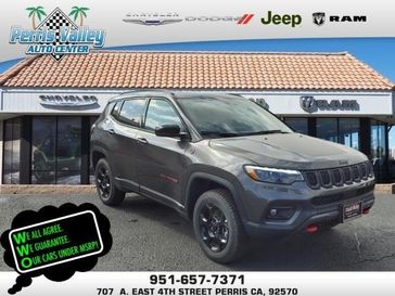 2024 Jeep Compass Trailhawk 4x4 in a Black Clear Coat exterior color and Ruby Red/Blackinterior. Perris Valley Chrysler Dodge Jeep Ram 951-355-1970 perrisvalleydodgejeepchrysler.com 