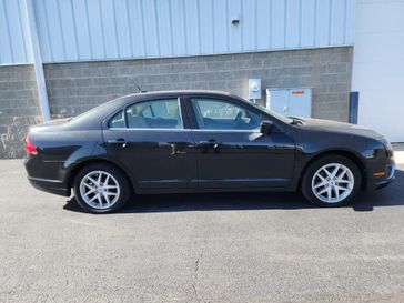 2012 Ford Fusion SEL in a Tuxedo Black exterior color and Camelinterior. Wilmington Auto Center Chrysler Dodge Jeep Ram (937) 556-6430 wilmingtonautocentercdjr.com 