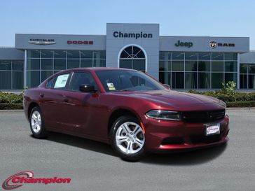 2023 Dodge Charger SXT Rwd in a Octane Red exterior color and HOUNDSTOOTHinterior. Champion Chrysler Jeep Dodge Ram 800-549-1084 pixelmotiondemo.com 