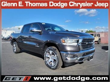 2024 RAM 1500 Laramie Crew Cab 4x4 5'7' Box in a Granite Crystal Metallic Clear Coat exterior color and Blackinterior. Glenn E Thomas 100 Years Of Excellence (866) 340-5075 getdodge.com 