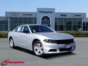 2023 Dodge Charger SXT Rwd in a Triple Nickel exterior color and HOUNDSTOOTHinterior. Champion Chrysler Jeep Dodge Ram 800-549-1084 pixelmotiondemo.com 