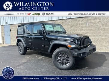 2024 Jeep Wrangler 4-door Sport S in a Black Clear Coat exterior color and Blackinterior. Wilmington Auto Center Chrysler Dodge Jeep Ram (937) 556-6430 wilmingtonautocentercdjr.com 