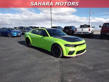 2023 Dodge Charger Scat Pack Widebody in a Sublime exterior color and Blackinterior. Sahara Motors Inc 435-500-5052 saharamotorschryslerdodgejeep.com 