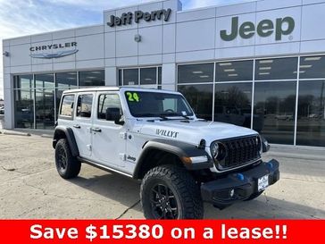 2024 Jeep Wrangler 4-door Willys 4xe in a Bright White Clear Coat exterior color and Blackinterior. Jeff Perry Chrysler Jeep 815-859-8394 jeffperrychryslerjeep.com 