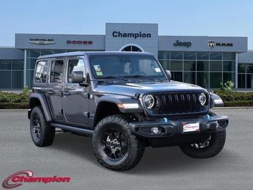 2024 Jeep Wrangler 4-door Willys 4xe in a Granite Crystal Metallic Clear Coat exterior color and CLOTHinterior. Champion Chrysler Jeep Dodge Ram 800-549-1084 pixelmotiondemo.com 