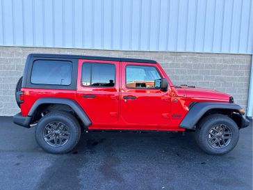 2024 Jeep Wrangler 4-door Sport S in a Firecracker Red Clear Coat exterior color and Blackinterior. Wilmington Auto Center Chrysler Dodge Jeep Ram (937) 556-6430 wilmingtonautocentercdjr.com 