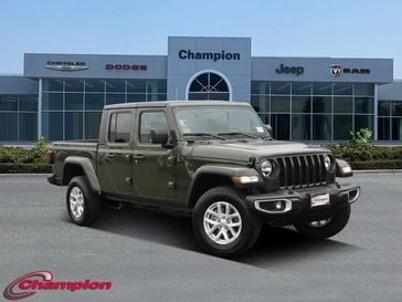 2023 Jeep Gladiator Sport S 4x4 in a Sarge Green Clear Coat exterior color and CLOTH LOW BACKinterior. Champion Chrysler Jeep Dodge Ram 800-549-1084 pixelmotiondemo.com 
