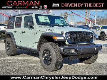 2024 Jeep Wrangler 4-door Willys in a Earl Clear Coat exterior color and Black - E7X9interior. Carman Chrysler Jeep Dodge Ram 302-317-2378 carmanchryslerjeepdodge.com 