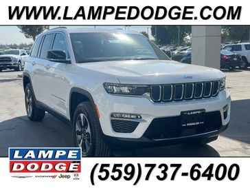 2023 Jeep Grand Cherokee 4xe in a Bright White Clear Coat exterior color and Wicker Beige/Blackinterior. Lampe Chrysler Dodge Jeep RAM 559-471-3085 pixelmotiondemo.com 