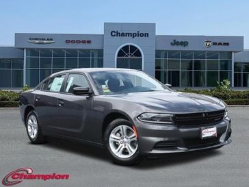 2023 Dodge Charger SXT Rwd in a Granite exterior color and HOUNDSTOOTH CLOinterior. Champion Chrysler Jeep Dodge Ram 800-549-1084 pixelmotiondemo.com 