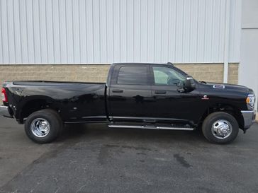 2024 RAM 3500 Tradesman Crew Cab 4x4 8' Box in a Diamond Black Crystal Pearl Coat exterior color. Wilmington Auto Center Chrysler Dodge Jeep Ram (937) 556-6430 wilmingtonautocentercdjr.com 