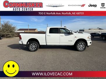 2023 RAM 2500 Laramie in a Bright White Clear Coat exterior color and Blackinterior. Cornhusker Auto Center 402-866-8665 cornhuskerautocenter.com 