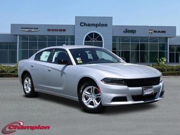 2023 Dodge Charger SXT Rwd in a Triple Nickel exterior color and HOUNDSTOOTHinterior. Champion Chrysler Jeep Dodge Ram 800-549-1084 pixelmotiondemo.com 