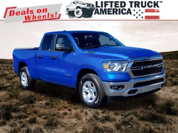 2024 RAM 1500 Big Horn in a Hydro Blue Pearl Coat exterior color and Diesel Gray/Blackinterior. Lifted Truck America 888-267-0644 liftedtruckamerica.com 