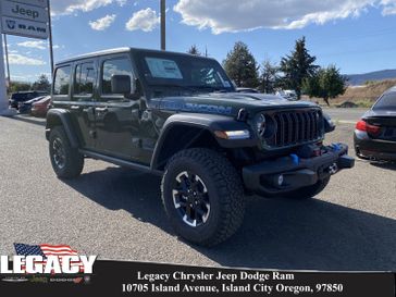 2024 Jeep Wrangler 4-door Rubicon 4xe in a Sarge Green Clear Coat exterior color and Blackinterior. Legacy Chrysler Jeep Dodge RAM 541-663-4885 legacychryslerjeepdodgeram.com 