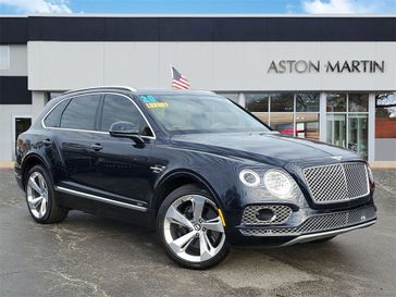 2020 Bentley Bentayga Hybrid in a Blue exterior color and Burnt Oak Hideinterior. Glenview Luxury Imports 847-904-1233 glenviewluxuryimports.com 