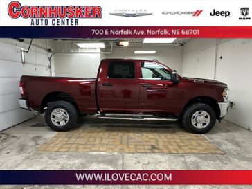 2024 RAM 2500 Tradesman in a Delmonico Red Pearl Coat exterior color and TXX8interior. Cornhusker Auto Center 402-866-8665 cornhuskerautocenter.com 