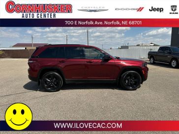 2022 Jeep Grand Cherokee Altitude in a Velvet Red Pearl Coat exterior color and Global Blackinterior. Cornhusker Auto Center 402-866-8665 cornhuskerautocenter.com 