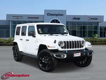 2024 Jeep Wrangler 4-door Sahara 4xe in a Bright White Clear Coat exterior color and MCKINLEY TRIMinterior. Champion Chrysler Jeep Dodge Ram 800-549-1084 pixelmotiondemo.com 