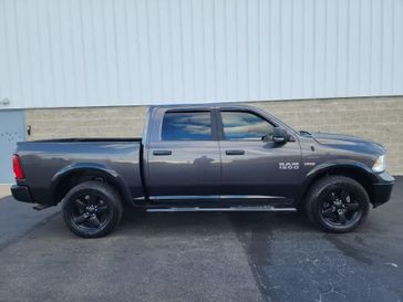 2015 RAM 1500 Outdoorsman 4WD Crew Cab 140.5 in a Granite Crystal Metallic Clear Coat exterior color and Diesel Gray/Blackinterior. Wilmington Auto Center Chrysler Dodge Jeep Ram (937) 556-6430 wilmingtonautocentercdjr.com 