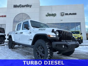 2023 Jeep Gladiator Willys 4x4 in a Bright White Clear Coat exterior color and Blackinterior. McCarthy Jeep Ram 816-434-0674 mccarthyjeepram.com 