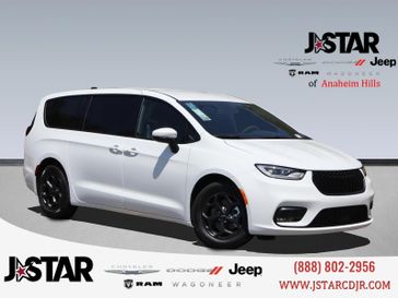 2023 Chrysler Pacifica Plug-in Hybrid Touring L in a Bright White Clear Coat exterior color and Blackinterior. J Star Chrysler Dodge Jeep Ram of Anaheim Hills 888-802-2956 jstarcdjrofanaheimhills.com 
