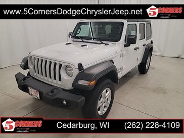 2018 Jeep Wrangler Unlimited Sport S in a Bright White Clear Coat exterior color and Taninterior. 5 Corners Dodge Chrysler Jeep 262-228-4109 5cornersdodgechryslerjeep.net 