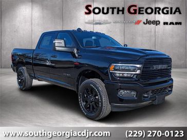 2024 RAM 2500 Laramie Crew Cab 4x4 6'4' Box in a Diamond Black Crystal Pearl Coat exterior color and Blackinterior. South Georgia CDJR 229-443-1466 southgeorgiacdjr.com 