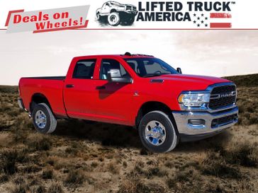 2024 RAM 2500 Tradesman in a Flame Red Clear Coat exterior color and Diesel Gray/Blackinterior. Lifted Truck America 888-267-0644 liftedtruckamerica.com 