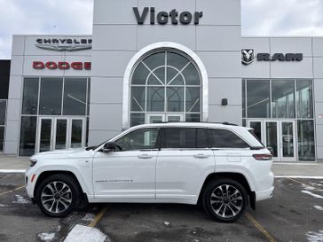 2023 Jeep Grand Cherokee Overland 4xe in a Bright White Clear Coat exterior color and Global Blackinterior. Victor Chrysler Dodge Jeep Ram 585-236-4391 victorcdjr.com 