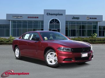 2023 Dodge Charger SXT Rwd in a Octane Red exterior color and HOUNDSTOOTHinterior. Champion Chrysler Jeep Dodge Ram 800-549-1084 pixelmotiondemo.com 