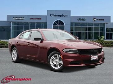 2023 Dodge Charger SXT Rwd in a Octane Red exterior color and HOUNDSTOOTHinterior. Champion Chrysler Jeep Dodge Ram 800-549-1084 pixelmotiondemo.com 