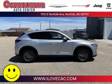 2021 Mazda CX-5 Touring in a Sonic Silver Metallic exterior color and Blackinterior. Cornhusker Auto Center 402-866-8665 cornhuskerautocenter.com 