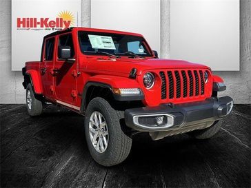 2023 Jeep Gladiator Sport S 4x4 in a Firecracker Red Clear Coat exterior color. Hill-Kelly Dodge (850) 786-2130 hillkellydodge.com 