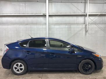 2014 Toyota Prius Three in a Nautical Blue Metallic exterior color and Misty Grayinterior. Wilmington Auto Center Chrysler Dodge Jeep Ram (937) 556-4751 wilmingtonautocentercdjr.com 