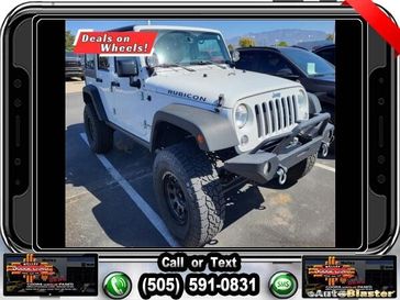 2015 Jeep Wrangler Unlimited Rubicon in a Bright White Clear Coat exterior color and Blackinterior. Melloy Dodge RAM FIAT 505-588-4459 melloydodge.com 