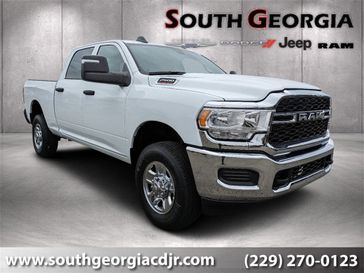 2024 RAM 2500 Tradesman Crew Cab 4x4 6'4' Box in a Bright White Clear Coat exterior color and Blackinterior. South Georgia CDJR 229-443-1466 southgeorgiacdjr.com 