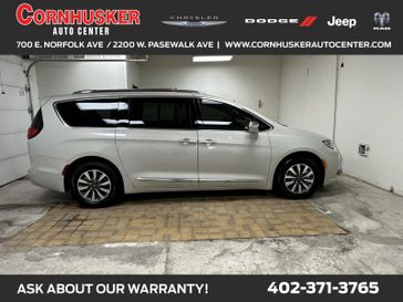2021 Chrysler Pacifica Hybrid Limited in a Luxury White Pearl Coat exterior color and Deep Mocha/Black/Dp Mochainterior. Cornhusker Auto Center 402-866-8665 cornhuskerautocenter.com 