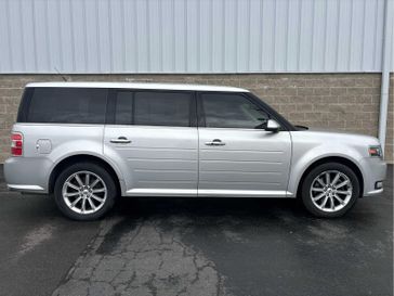 2015 Ford Flex Limited in a Ingot Silver Metallic exterior color and Charcoal Blackinterior. Wilmington Auto Center Chrysler Dodge Jeep Ram (937) 556-6430 wilmingtonautocentercdjr.com 