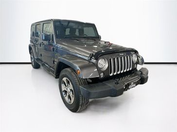 2017 Jeep Wrangler JK Unlimited Sahara in a Granite Crystal Metallic Clear Coat exterior color and Blackinterior. Sheridan Motors Auto (307) 218-2217 sheridanmotors.com 